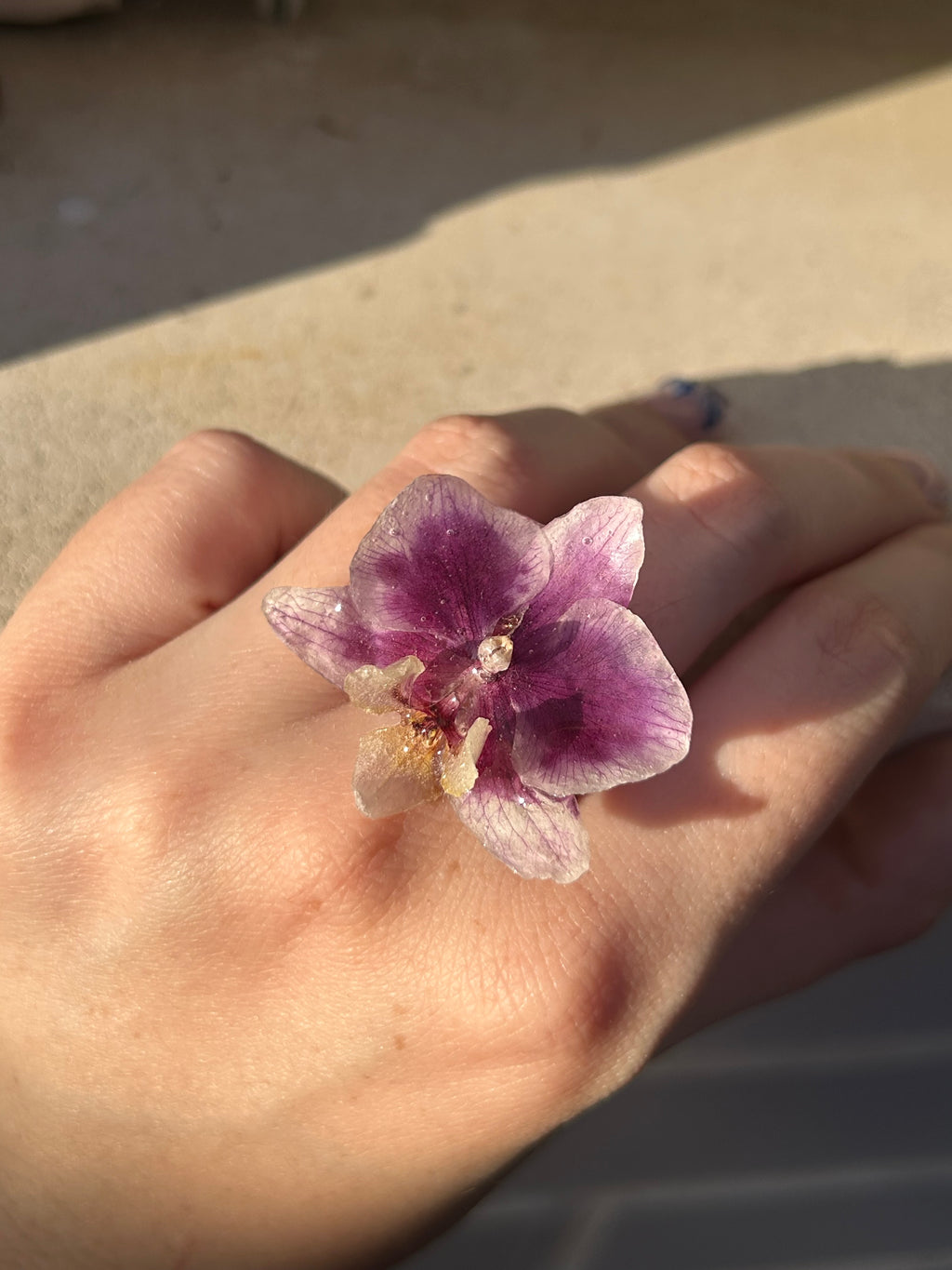 Anillo orquídea real encapsulada